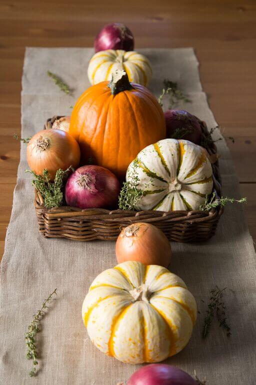Thanksgiving centerpiece with onions and pumpkins