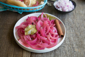 white plate with pickled onions