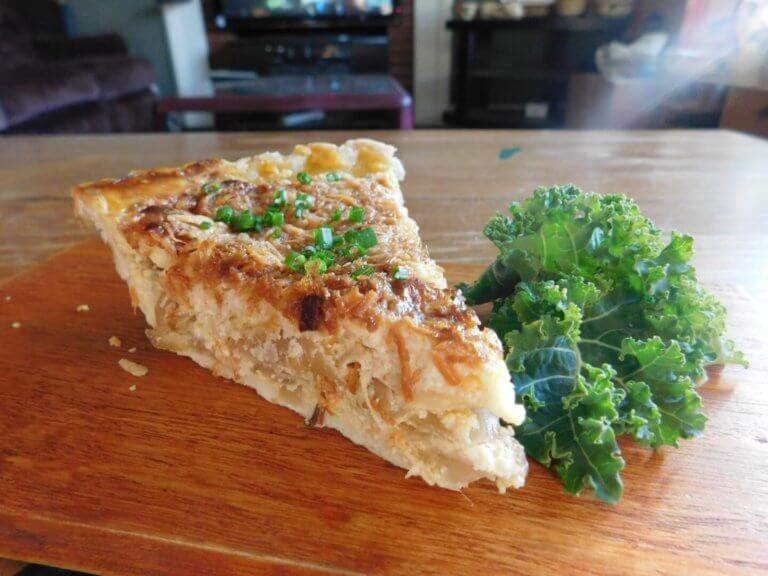 Slice of onion pie with parsley