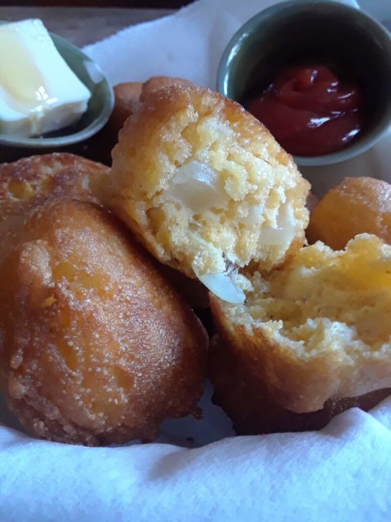 These hushpuppies come rife with diced onions and grits to make them extra special.