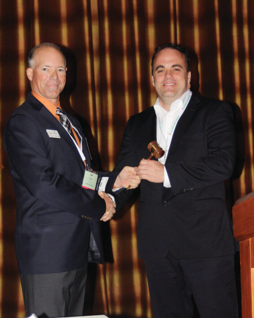 Gary Mayfield (2012-14), left, passes the gavel to Shawn Hartley (2014-16).
