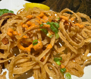 Lazy Dog Saloon onion rings with sauce