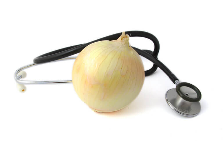 Onion and stethoscope on a bright background