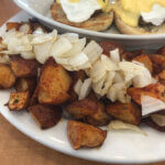 Diced onions atop fried potatoes at La Croisette Breakfast and Lunch Restaurant in St. Pete Beach, FL