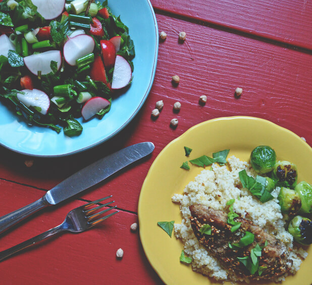 Dinner plate and salad plat eon a red background