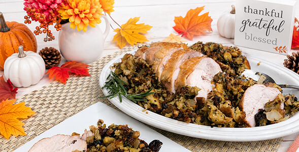 Turkey and Stuffing on a white plate with fall background