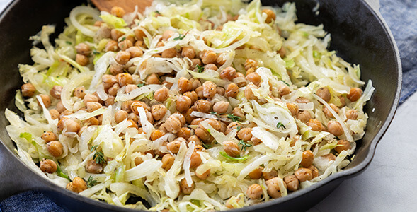 Skillet Cabbage with Onions and Cabbage in a cast iron skillet